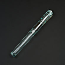 Load image into Gallery viewer, A Franklin-Christoph Model 03 Iterum in Antique Glass &amp; Onyx with a silver clip rests on a black background.