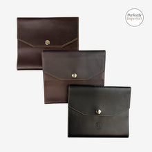 Load image into Gallery viewer, Franklin-Christoph A6 snap notebook covers in dark brown, brown, and black FxCel leather with creme stitching and snap closure.
