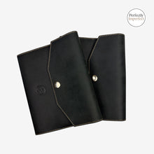 Load image into Gallery viewer, Franklin-Christoph black boot leather A6 snap notebook covers with creme stitching and debossed Celtic logo.