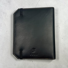 Load image into Gallery viewer, Franklin-Christoph black leather A6 Command Center Padfolio with tan stitching, elastic closure, and embossed logo.