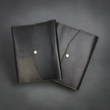 Load image into Gallery viewer, Franklin-Christoph black Napa leather A5 notebook cover with snap closure and debossed Celtic logo.