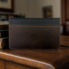Load image into Gallery viewer, Franklin-Christoph two-tone boot leather checkbook cover in brown and black with Celtic knot detail.