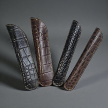 Load image into Gallery viewer, Franklin-Christoph single pen sleeve in croc-embossed leather, available in black and brown. Creme stitching and debossed logo.