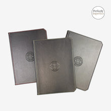 Load image into Gallery viewer, Franklin-Christoph Firma-Flex A5 journal notebooks in grey and charcoal with debossed Celtic knot logo and color-coded stitching.