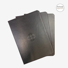 Load image into Gallery viewer, Franklin-Christoph Firma-Flex A6 notebook with black debossed Celtic knot logo and maroon stitching. Flexible cover.