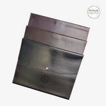 Load image into Gallery viewer, Franklin-Christoph A4 snap notebook cover in black, brown, and maroon FxCel leather with snap closure and interior pockets.