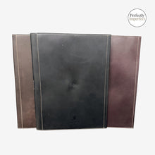 Load image into Gallery viewer, Franklin-Christoph A4 FxCel leather notebook covers in black, brown, and maroon. Features snap closure, exterior pocket, and interior pen loop.