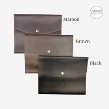 Load image into Gallery viewer, Franklin-Christoph A5 snap notebook cover in maroon, brown, or black FxCel leather with snap closure and interior pockets.