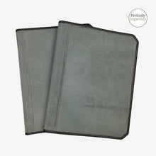 Load image into Gallery viewer, Franklin-Christoph grey canvas A5 padfolio with dark brown stitching and trim, featuring internal pockets and pen loop.