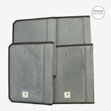Load image into Gallery viewer, Franklin-Christoph A5 and A4 padfolios in grey distressed canvas with black trim and stitching. Features interior pockets and pen loop.
