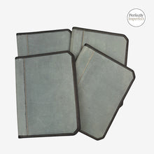 Load image into Gallery viewer, Franklin-Christoph grey canvas A5 and A4 padfolios with black trim and stitching, featuring internal pockets and pen loop.