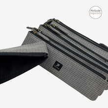 Load image into Gallery viewer, Franklin-Christoph grey fabric zippered pen pouch with antiqued brass zipper and dual logos.