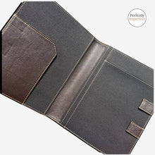 Load image into Gallery viewer, oakstreetbootmakers.mommand Center Padfolio in black and brown leather with tan stitching. Features pen slot, document flap, and elastic closure.