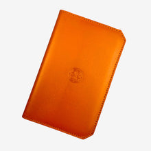 Load image into Gallery viewer, Franklin-Christoph orange leather 5.3 pocket notebook cover with embossed Celtic knot logo.