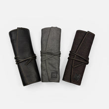 Load image into Gallery viewer, Franklin-Christoph Seven Pen Roll in black leather, grey fabric, and brown fabric. Features tie closure and contrast stitching.