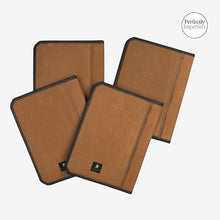 Load image into Gallery viewer, Franklin-Christoph Umber canvas padfolios with black trim and interior pockets. Available in A5 and A4 sizes.